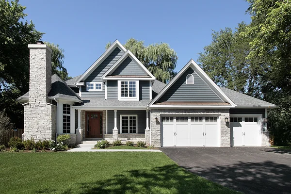 The image is a freshly painted gray home with a white brick chimney. As painting contractors, Sutton Construction is dedicated to do clean beautiful work. The image is a freshly painted gray home with a white brick chimney. As painting contractors, Sutton Construction is dedicated to do clean beautiful work.
