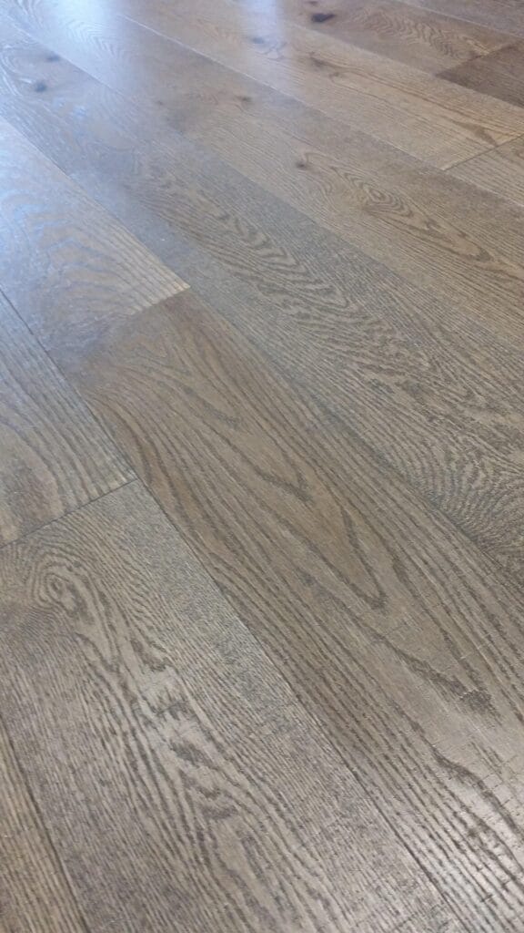 Flooring is functional beautiful and makes a statement just like this newly refinished red oak flooring.